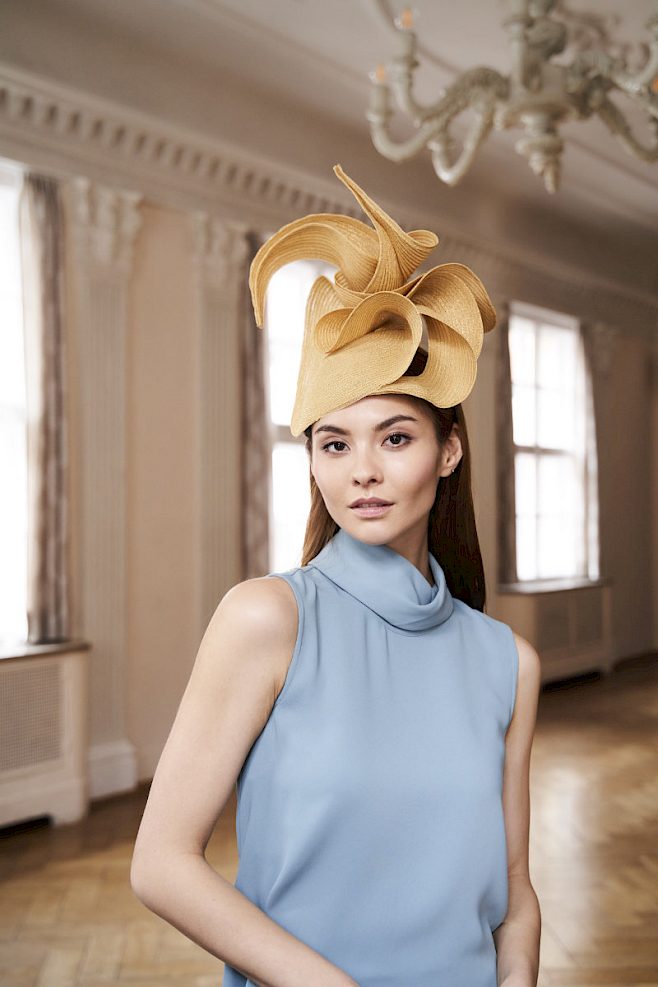 Gold fascinator hat wedding guest